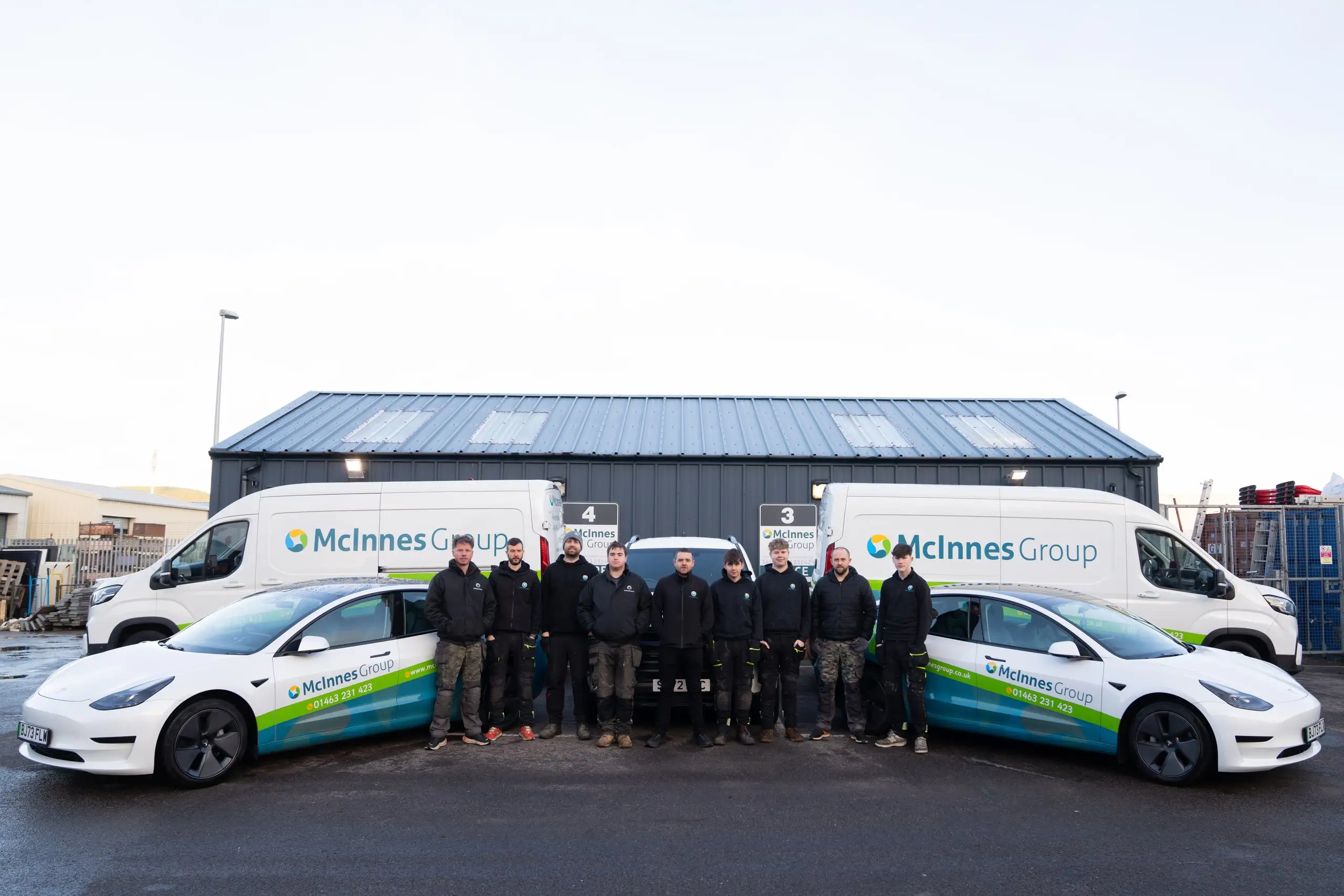 The McInnes Group team and branded fleet outside the Inverness HQ