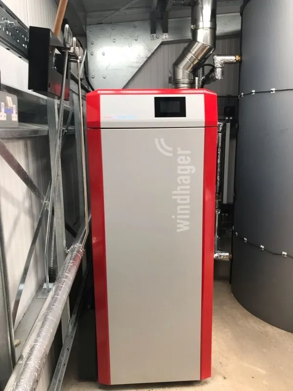 A Windhager pellet boiler and buffer tank installed in a customer's plant room